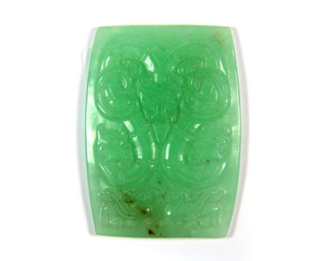 A finely carved Chinese jade inset for a box lid featuring a double headed dragon, 5.5 x 4cm.