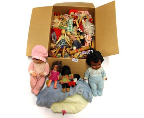 A quantity of vintage wooden dolls and others.