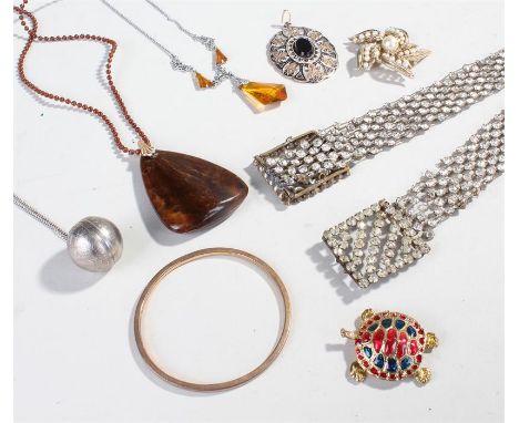 Mixed lot of costume jewellery comprising of three necklaces, one belt, one pendant, one bangle and one brooch.