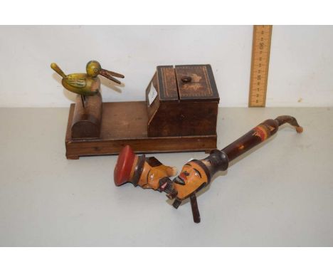 Novelty cigarette dispenser with bird mount together with a novelty figural pipe