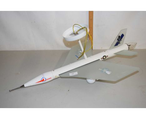 A novelty light fitting formed as a Jet aircraft