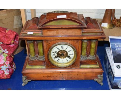A late 19th Century mantel clock in architectural hardwood case