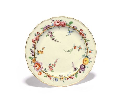 A Worcester dessert plate, c.1770, painted in the London atelier of James Giles, with a variety of European flowers encirclin