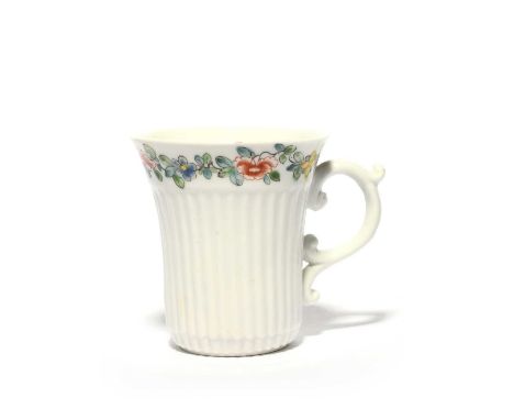 An early Worcester reeded coffee cup, c.1753-54, the slender form moulded with vertical flutes, finely painted around the fla
