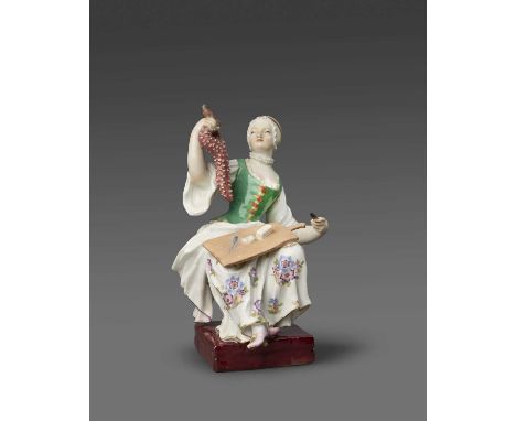 A Meissen figure of a female cook, c.1760, modelled by Johann Joachim Kändler, seated with a chopping board on her lap, holdi