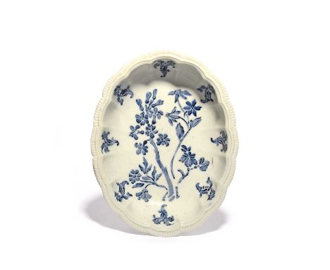 An early Doccia dish, c.1750-52, with stencilled 'a stampino' or 'a stampa' decoration in underglaze blue, a central flowerin