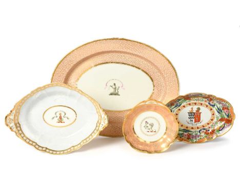 Four Flight and Barr armorial dishes, c.1810-30, the largest painted with a crest and motto 'Sperat Infestis Metuit Secundes'