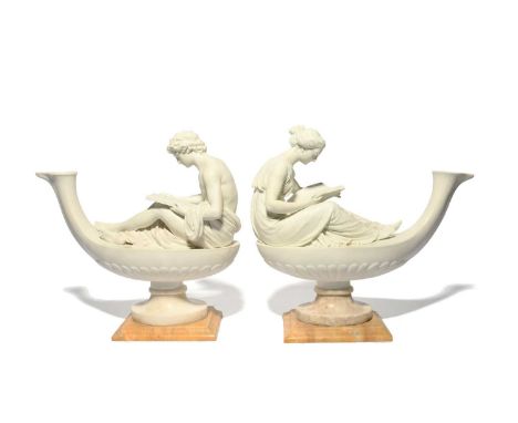 A pair of Sèvres biscuit porcelain figural oil lamps, late 18th/early 19th century, attributed to Boizot, the figures of Le P