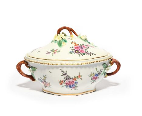 A large Worcester tureen and cover, c.1770-75, the quatrefoil form painted with sprays of flowers, the handles and finial for