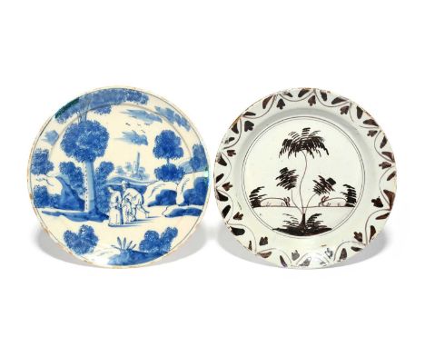 Two London delftware plates, 1720-40, one painted in manganese with two grazing rabbits flanking a tree, the other in blue wi