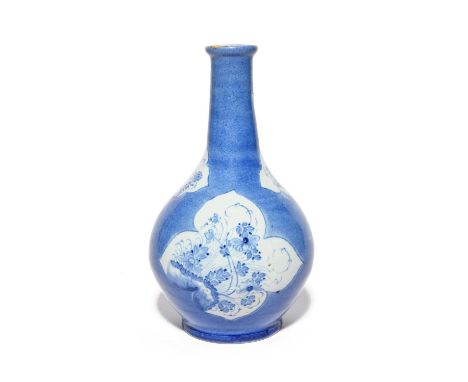 A Vauxhall delftware bottle, c.1750, attributed to Jonathan and Mary Chilwell, painted with shaped panels of Oriental plants 