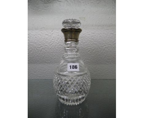 HM SILVER COLLARED CUT GLASS DECANTER AND STOPPER A/F
