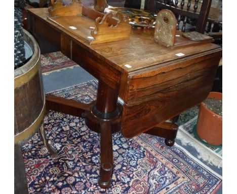 A REGENCY ROSEWOOD SOFA TABLE, with rectangular top with drop-flap ends above two short frieze drawers, on a turned column an