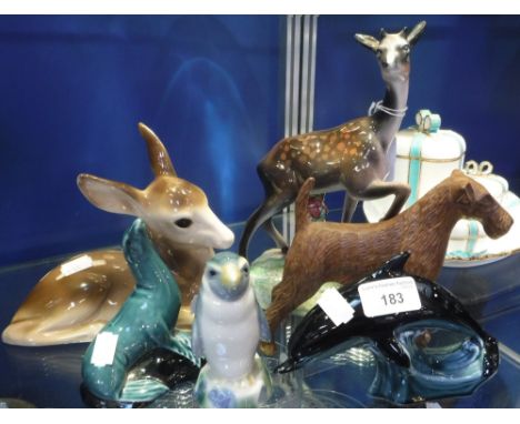A POOLE POTTERY DOLPHIN and similar animal ornaments