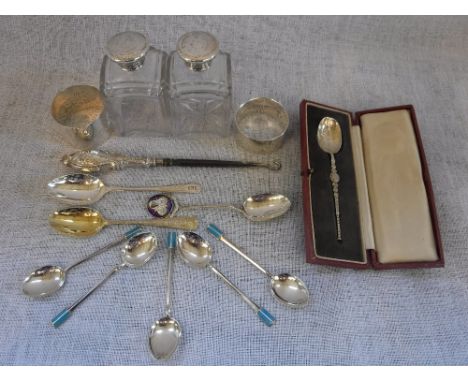 A CASED SILVER CELTIC DESIGN CHRISTENING TEASPOON and a collection of other silverwares, including two silver-topped bottles 