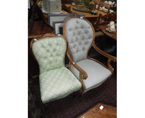 A VICTORIAN BUTTON-BACKED ARMCHAIR with shaped back and seats with carved and moulded open arms and another smaller chair
