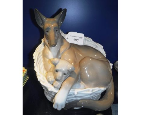 A LLADRO FIGURE GROUP OF A GERMAN SHEPHERD AND PUPPY IN A BASKET