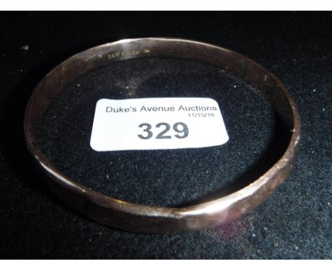 A 9CT ROSE GOLD BANGLE