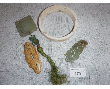 FOUR CHINESE JADE/HARDSTONE ORNAMENTS including a Neolithic style calcified ring and three other items