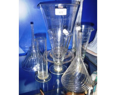 A CLEAR GLASS MEASURING FLASK and other similar items