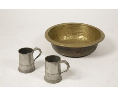 A GEORGE IV PEWTER QUART TANKARD, another similar and a broad brass basin (3)