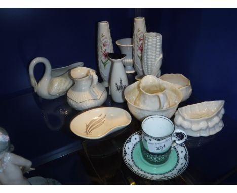 BELLEEK: A SWAN, a small study of boat, jug and sucrier, other Belleek ceramics and similar items