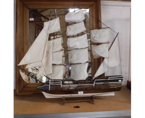 A WOODEN MODEL OF A FULLY RIGGED THREE MASTED GALLEON