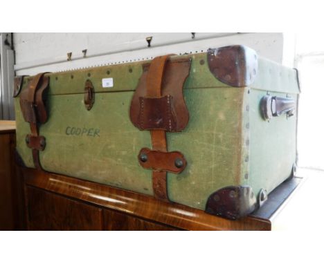 A LARGE VINTAGE LEATHER BOUND CANVAS TRUNK