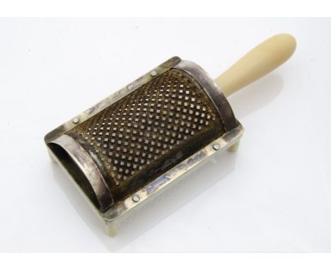 A George III period ivory and silver table nutmeg grater, the curved steel grate with silver mounts, marked with duty mark, S