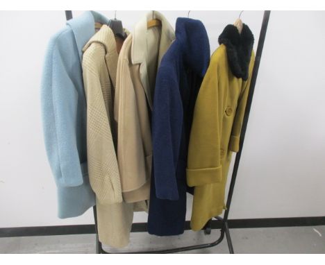 Ladies vintage coats, including a Jaeger of London navy blue woollen belted coat, a Elmorata light blue lambs wool coat (miss