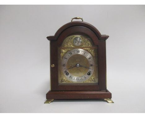 An 18th Century style mahogany cased bracket clock by Elliott,  the arched brass dial with a 'Tempus Fugit' plaque over a sil