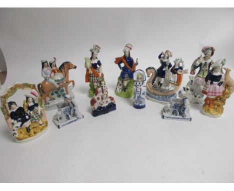 A group of predominantly British Victorian Staffordshire figures,  to include 'Returning Home' height 22cm, together with a p