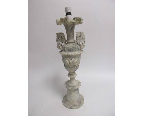 A 20th Century marble lamp base, modelled as a twin-handled urn with fluted edges upon a circular stepped base, height 58cm