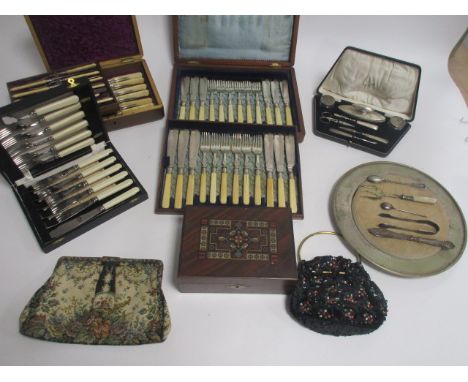 An Elkington hallmarked silver manicure set, together with three cases of silver plated flatware, an early 20th Century sequi