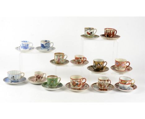 Twenty pairs of 20th Century cups and saucers,  predominantly from China and Japan, decorated with figures, birds, and butter