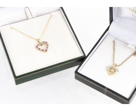 A ruby and diamond heart shaped pendant, on a 9ct gold chain, boxed together with a gilt metal paste set heart pendant on a g