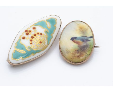 A Royal Worcester porcelain 9ct gold framed oval brooch, decorated with a red breasted bullfinch, signed E Barker, marked wit