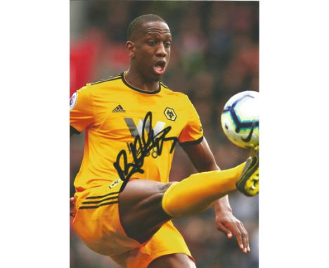 Football Willy Boly signed 12x8 colour photo pictured playing for Wolves. Good Condition. All signed pieces come with a Certi