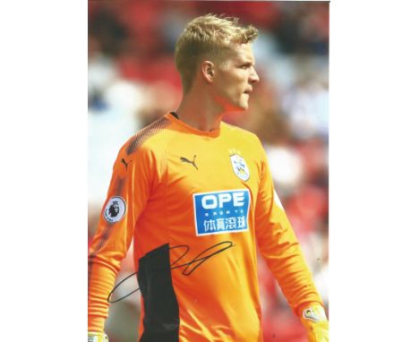 Football Jonas Lossl signed 12x8 colour photo pictured playing for Huddersfield Town. Good Condition. All signed pieces come 