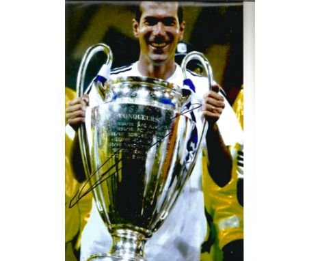 Football Zinedine Zidane 12x8 signed colour photo pictured with the champions league trophy while playing for Real Madrid. Zi