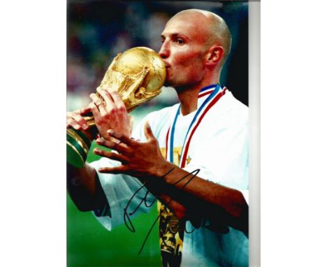 Football Frank Leboeuf 12x8 signed colour photo pictured with the World Cup trophy while playing for France. Franck Alain Jam