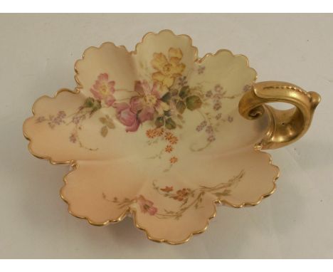 A Royal Worcester blush ivory shell shaped dish, decorated with flowers, having a gold handle, shape number 1404, circa 1895,