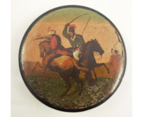 A 19th century papier mache snuff box, of circular form, the top decorated with a battle scene, diameter 3.5ins