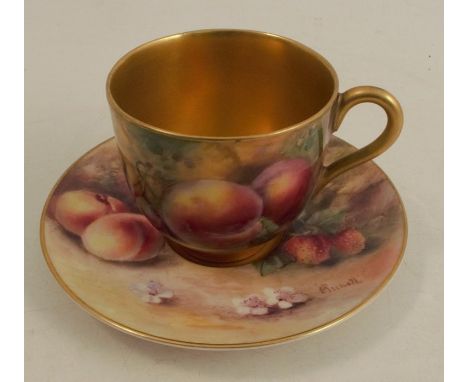 A Royal Worcester miniature coffee cup and saucer, decorated with hand painted fruit by Rushton and Price, circa 1925 and 191