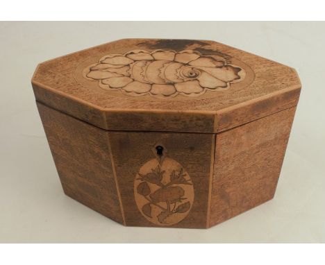 A 19th century mahogany tea caddy, of elongated octagonal form, inlaid with a shell to the top and a flower to the front, the