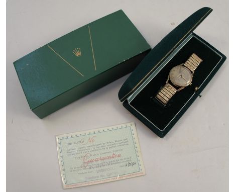 Rolex, a gentleman's 9 carat gold mechanical wrist watch, the circular white signed dial with gilt Arabic numerals, and hands