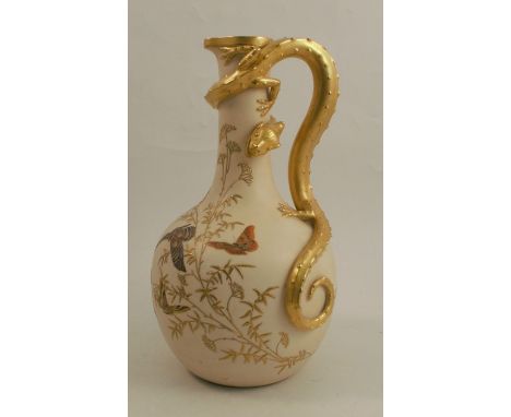 A 19th century Royal Worcester gilded ivory ewer, having lizard handle and decorated with shot silk colours with butterflies 