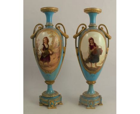 A pair of Royal Worcester pedestal vases, both decorated with oval reverses of children in landscape by J Rushton, to a turqu