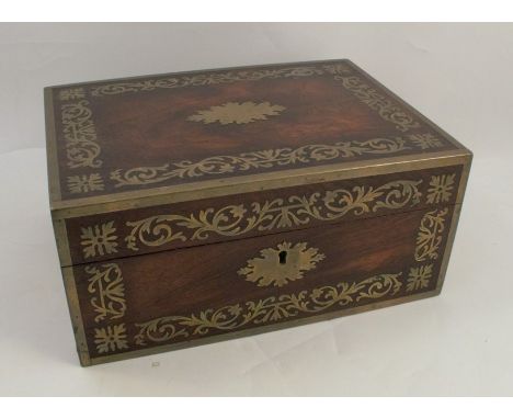 A 19th century rosewood and cut brass vanity case, with decoration to the top and front, the interior fitted with two lift ou