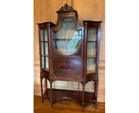 An Edwardian style mahogany secretaire display cabinet,  having a central shield shaped glazed door, flanked by two glazed do